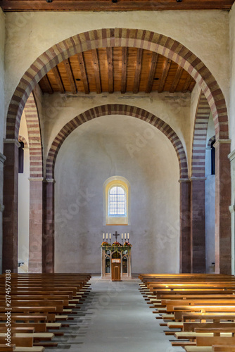 Bild auf Leinwand Romanesque Church Interior with Striped Stone Arches, Reichenau Island