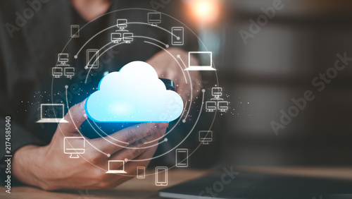 Obraz na płótnie IT specialist manages cloud computing and device connectivity to enable data synchronization, remote access, cloud storage, network integration, secure sharing, scalability, and digital collaboration.