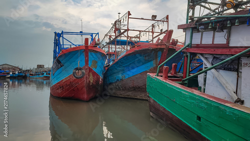 Bild auf Leinwand Colorful Fishing Boats On Water