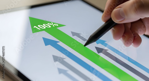 Business Growth and Success Concept with Upward Arrows and 100% Achievement on Digital Tablet