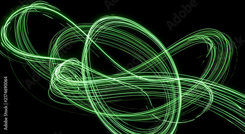 Abstract Green Neon Light Trails and Glowing Energy Lines on Black Background for Technology and Futuristic Design
