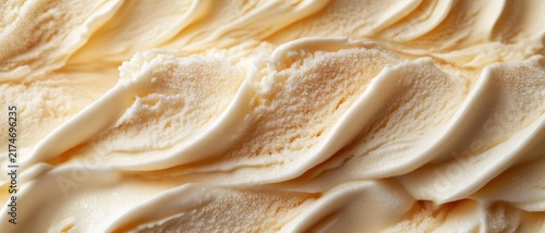 close-up of swirled creamy vanilla ice cream texture, indulgent and smooth