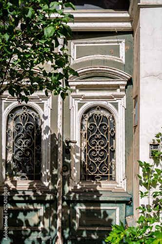 Ornate weathered green wooden door