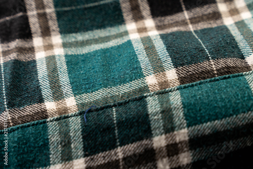 Synthetic material,  checked shirt close up shot for background.