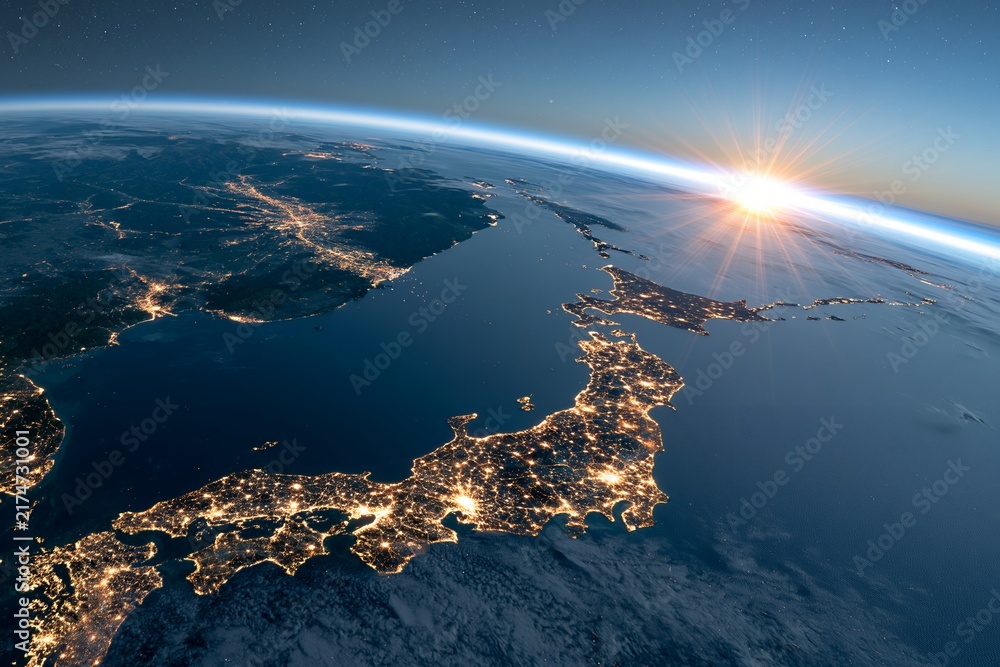 Fototapeta premium 広大な宇宙空間から日本列島の美しい夜景に光が差し込む日の出