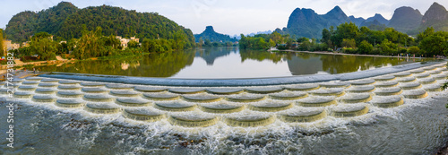 Scenic river and fish scale dam with karst mountains in Guilin, Guangxi, China