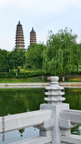 Twin Pagodas Over Green Park and Lake