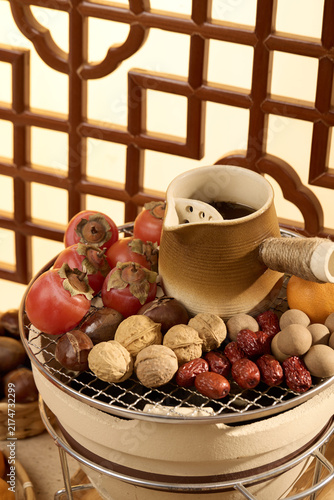 Traditional Asian Tea Set with Persimmons, Nuts and Dried Fruits