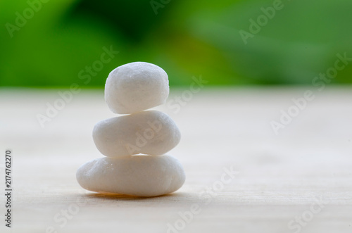 Cuadro en lienzo Minimal white zen stones representing harmony and spiritual balance, with customizable space for text