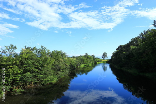 Peaceful Pond Reflecting the Blue Sky and Clouds in Yamamotoyama, Ojiya, Niigata, Japan