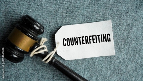 Canvas Print Judge gavel with the words Counterfeiting is the illegal creation, reproduction,