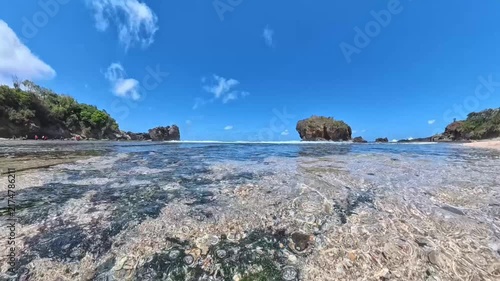 Tropical Beach with Crystal Clear Water and Rock Formations