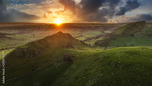 Stunning aerial drone landscape image of Parkhouse and Chrome Hills in Peak Distrcit at sunset durting Autumn Winter