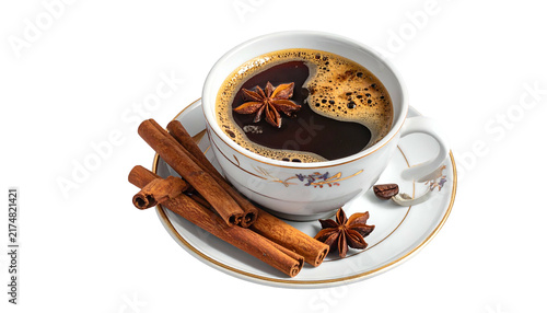 Close-up of a cup filled with dark, aromatic coffee, decorated with star anise and cinnamon sticks on a saucer