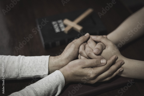 Fotografía People praying together with hands held, representing Christian faith, religion, worship, blessing, hope, and unity