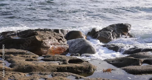 Powerful ocean waves crashing on a rocky coast