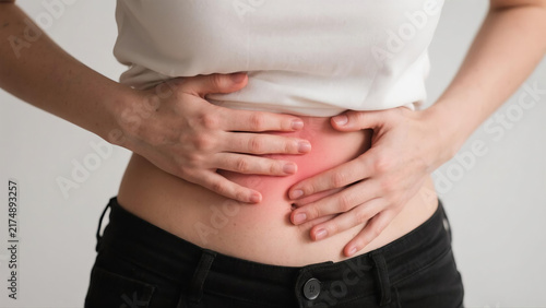 Pelvic pain stomachache concept. Hands of young woman on stomach as suffer on menstruation cramp, indigestion,gastrointestinal,diarrhea problem