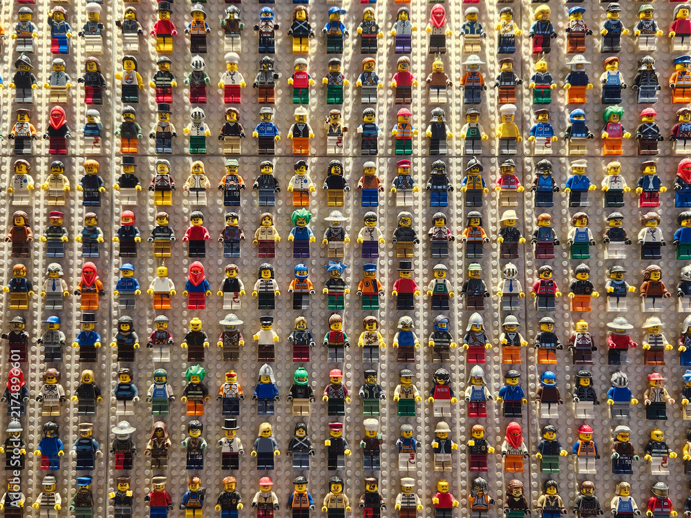 Obraz premium Billund, Denmark. August 17, 2006, LEGO minifigures of various characters and professions arranged in a grid, showcasing a hobby and passion for collecting toys