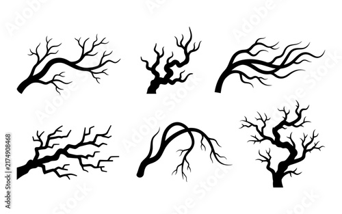 A collection of six black silhouette tree branches isolated on a white background perfect for spooky halloween designs and dark forest themed graphic art projects