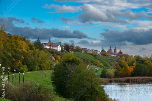 Fotografie Beautiful panoramic view of Płock cityscape with Vistula river and historical cathedral on hill