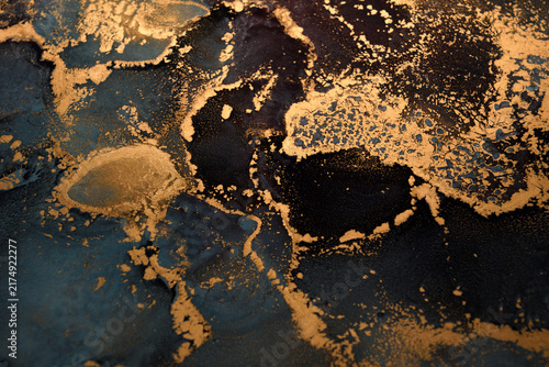 Artistic background featuring blue-gray swirls with gold accents; wide shot.