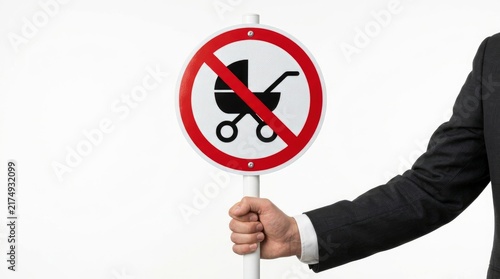 Hand in business suit holding a no baby stroller prohibition sign