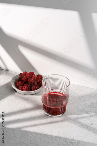 mashed raspberries in a glass