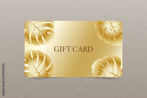 A template of a gold gift card with a design featuring Monstera leaves. Vector illustration.