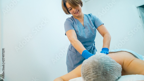 back massage in office crepatura osteopathy relaxation stones