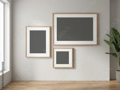 Quadro su tela Three blank picture frames asymmetric collage mockup on grey wall