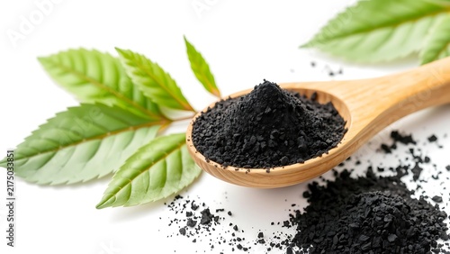Black Maca Powder in Wooden Spoon