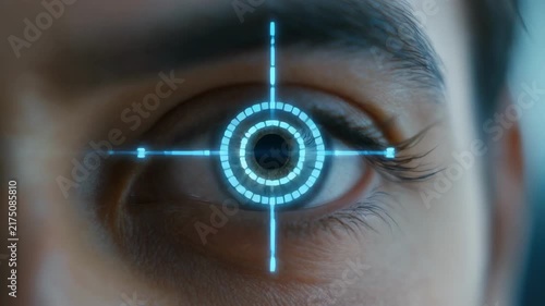 Man's eye blinking with futuristic digital iris overlay during technological advancement