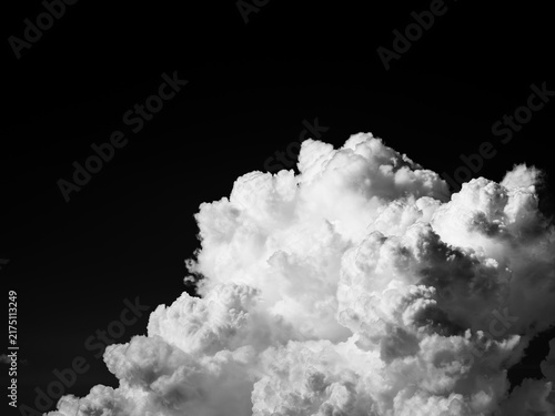 Monochrome summer cumulonimbus cloud against a dark sky