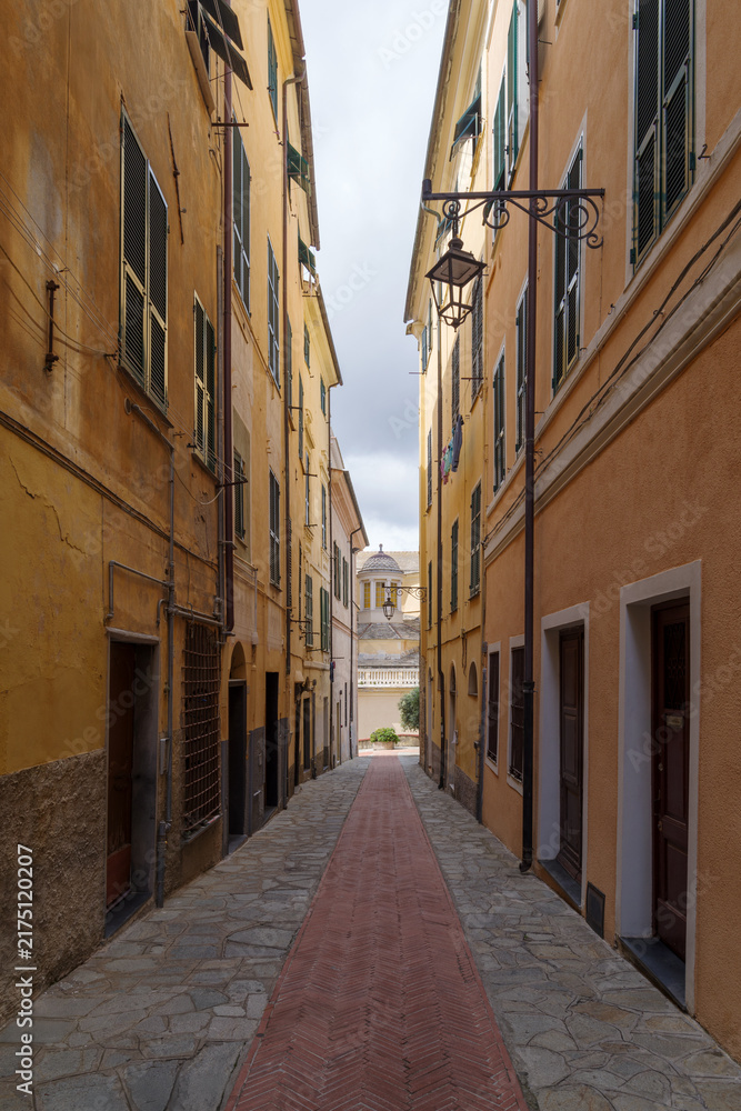 Fototapeta premium Pedestrian street in the old town of Imperia, seaside city on the Italian Riviera