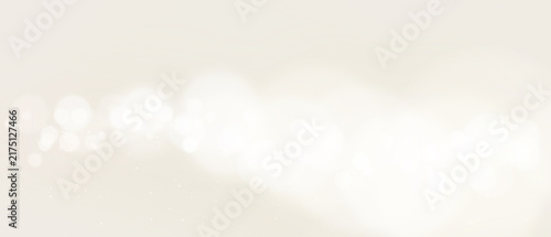 Bokeh background Soft white circular lights on a beige with defocused
