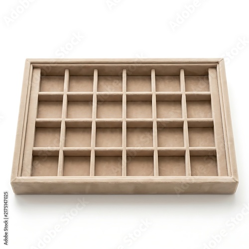 Empty beige velvet jewelry display tray with multiple square compartments for organization.