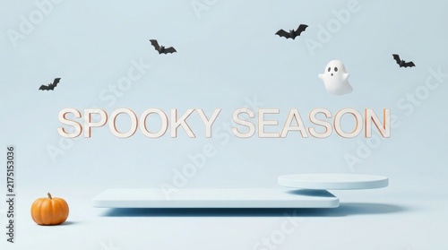 A festive happy halloween display featuring a small orange pumpkin and flying black bats on a light blue background