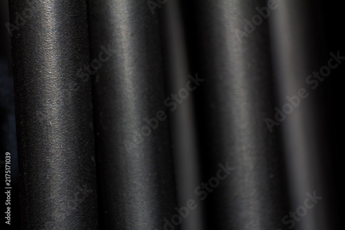 Принти на полотні Abstract Close-up View of Industrial Black Metal Pipes Featuring Smooth Cylindri