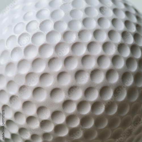 Extreme close-up texture of a white dimpled sphere, showing its surface pattern