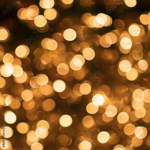 Blurred golden orbs create a warm, festive, and ethereal ambient light display