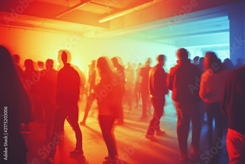 people of ai, party crowd dancing beneath red and cyan lights, photorealistic