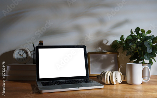 Принти на полотні Blank laptop screen displayed on a styled modern workspace desk.