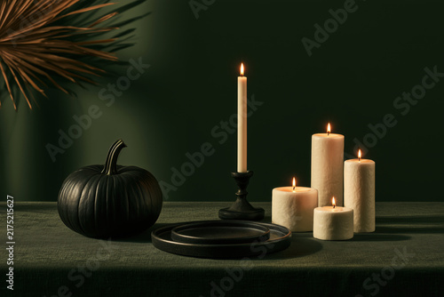 Elegant halloween table setting with candles and decor