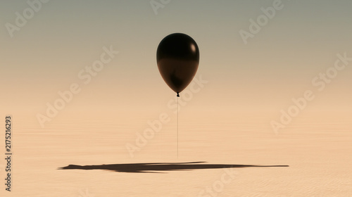 Black balloon floating in a surreal desert landscape