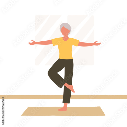 Older woman practicing yoga in a bright studio with large windows. Elderly set  