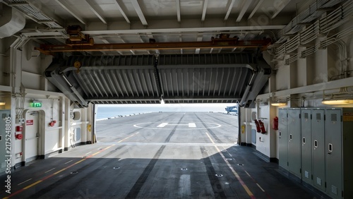 Interior View of Aircraft Carrier Hangar with Open Hangar Door