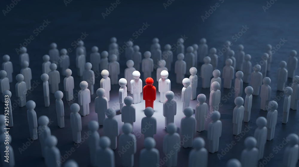 Fototapeta premium Red humanoid figure standing out from a white crowd under a spotlight, illustrating a unique leadership concept and professional
