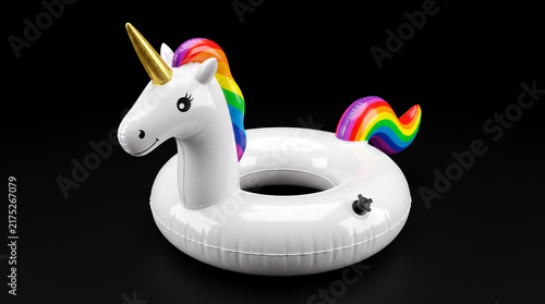 Inflatable white unicorn pool float with rainbow mane.