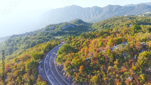 Montenegro mountain serpentine road near Podgorica with autumn forest and rocky mountains