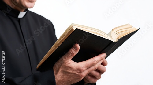 Priest Reading Bible Book In Black Robes For Preaching